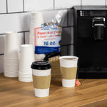 Karat 16 oz White Paper Coffee Cups with Black PP Sipper Lids & Cup Jackets — 250 sets