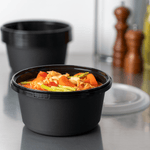 Karat 44 oz PP Tamper Resistant Injection Molded Microwaveable Black Food Container w/Clear lid — 150 sets
